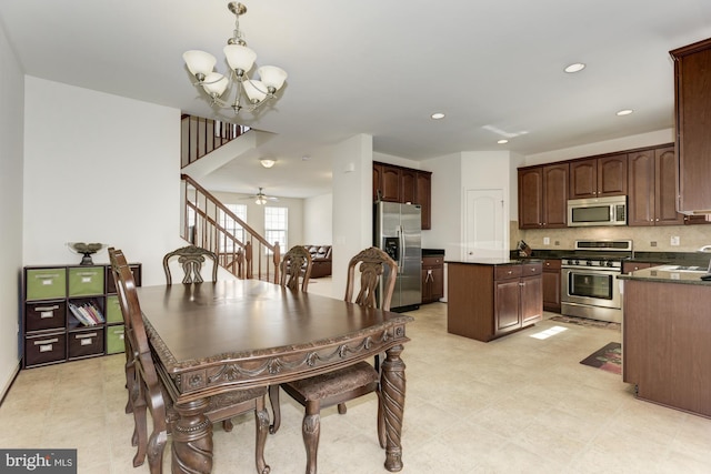 22672 Flowing Spring Sq, Brambleton, VA 20148 - dining space featuring a chandelier, stairs, and recessed lighting