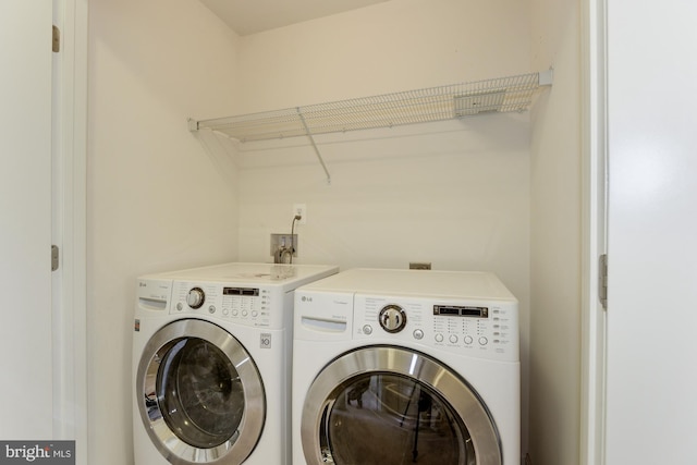 22672 Flowing Spring Sq, Brambleton, VA 20148 - washroom featuring washing machine and dryer