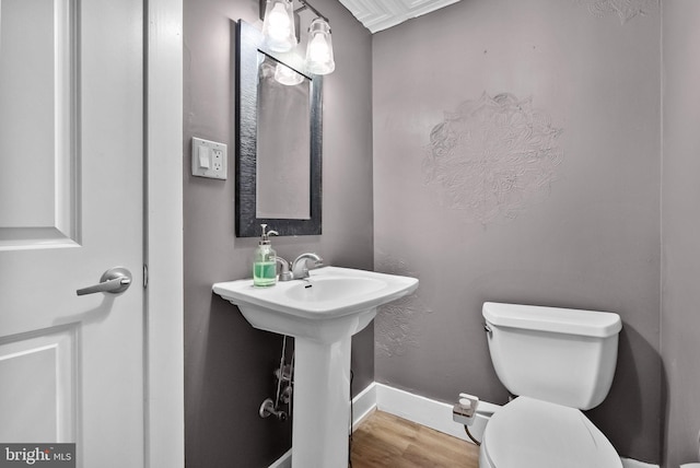 1001 S Chadwick St, Philadelphia, PA 19146 - bathroom featuring toilet, wood finished floors, a sink, and baseboards