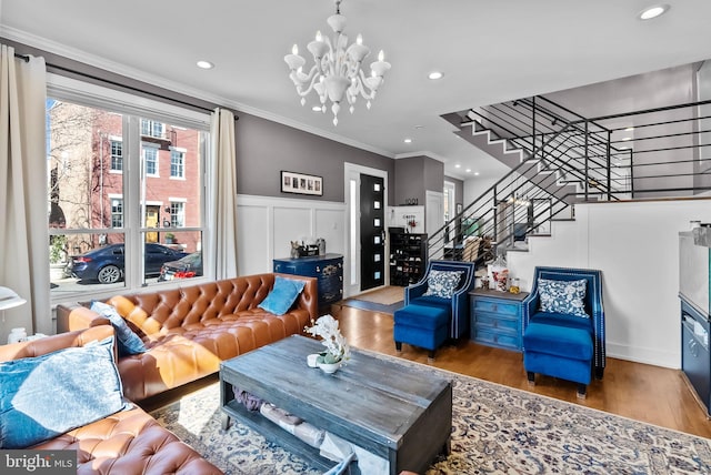 1001 S Chadwick St, Philadelphia, PA 19146 - living area featuring crown molding, stairway, wood finished floors, recessed lighting, and a chandelier
