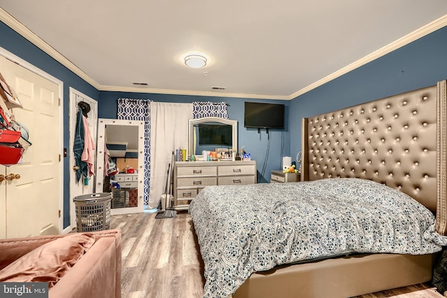 644 Luthardt Rd, Middle River, MD 21220 - bedroom with crown molding, wood finished floors, and baseboards