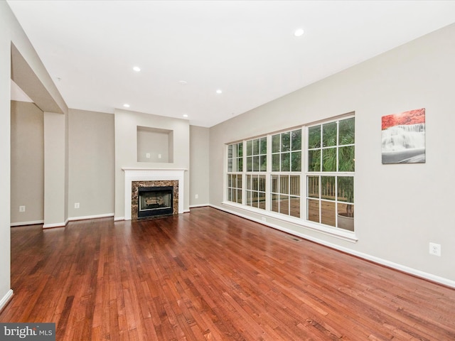 11937 Saint Francis Way, Bowie, MD 20721 - unfurnished living room featuring hardwood / wood-style flooring, baseboards, recessed lighting, and a fireplace