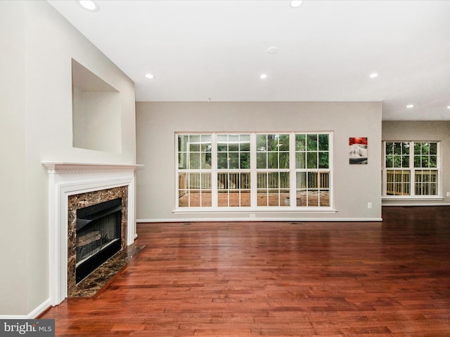 11937 Saint Francis Way, Bowie, MD 20721 - unfurnished living room featuring wood finished floors, recessed lighting, a high end fireplace, and baseboards