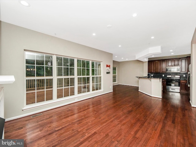 11937 Saint Francis Way, Bowie, MD 20721 - unfurnished living room with dark wood finished floors, recessed lighting, and baseboards