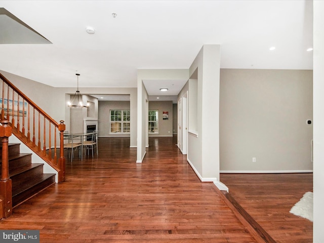 11937 Saint Francis Way, Bowie, MD 20721 - foyer entrance with wood finished floors, stairway, a fireplace, baseboards, and a chandelier