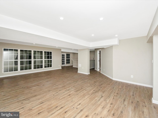 11937 Saint Francis Way, Bowie, MD 20721 - unfurnished living room with wood finished floors, baseboards, and recessed lighting