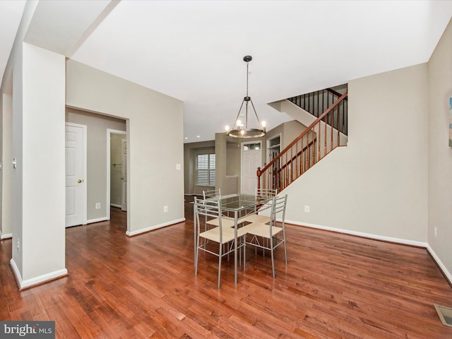 11937 Saint Francis Way, Bowie, MD 20721 - dining room with stairs, a chandelier, wood finished floors, and baseboards