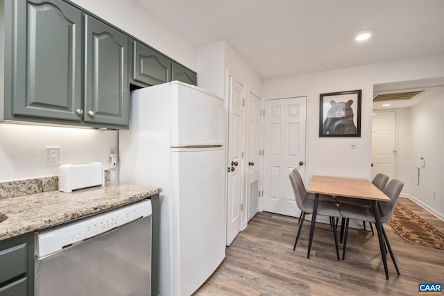 2028 Stone Rdg, Condos, Wintergreen Resort, VA 22967 - kitchen with dishwasher, wood finished floors, freestanding refrigerator, light stone counters, and recessed lighting