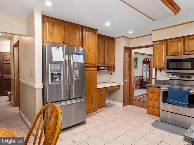 1112 Stromko Dr, Fallston, MD 21047 - kitchen with appliances with stainless steel finishes, brown cabinets, light tile patterned flooring, recessed lighting, and baseboards