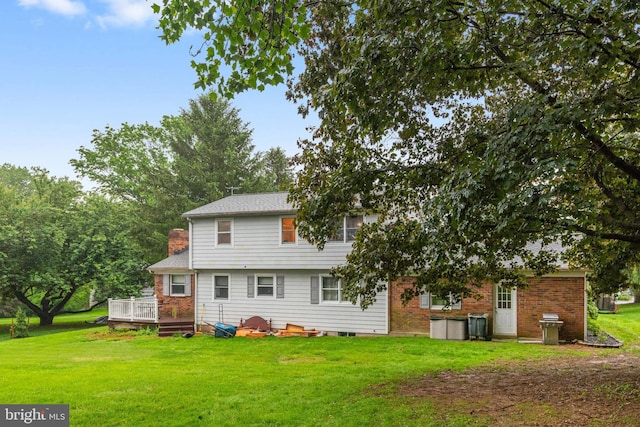 1112 Stromko Dr, Fallston, MD 21047 - back of house with a wooden deck, a lawn, and a chimney