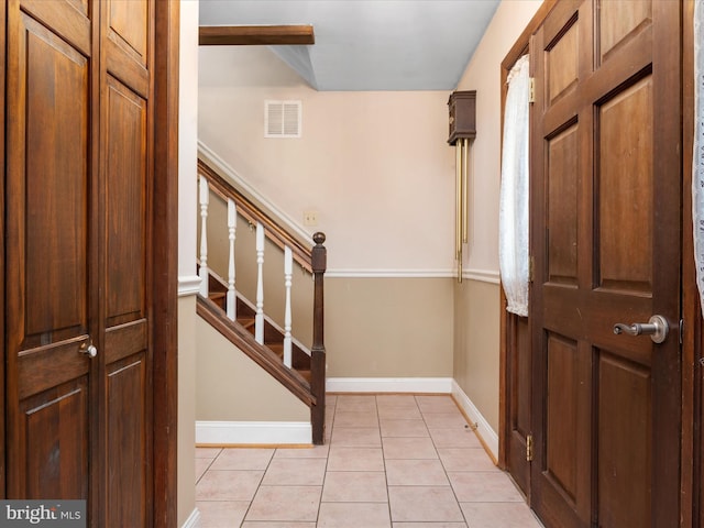 1112 Stromko Dr, Fallston, MD 21047 - entrance foyer featuring light tile patterned flooring, stairs, and baseboards