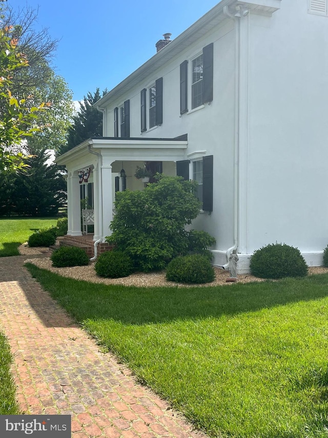27986 Old Valley Pike, Toms Brook, VA 22660 - view of property exterior featuring stucco siding, a yard, and a chimney