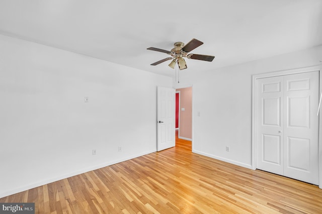 27 Willow Rd, Bordentown, NJ 08505 - unfurnished bedroom with light wood-style floors, baseboards, a closet, and a ceiling fan