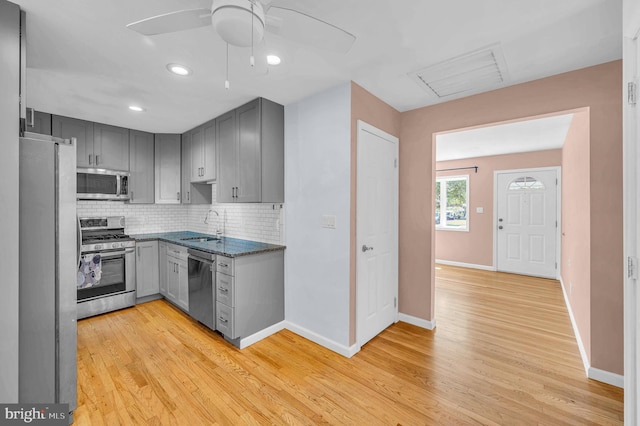 27 Willow Rd, Bordentown, NJ 08505 - kitchen with appliances with stainless steel finishes, gray cabinetry, light wood-style floors, and recessed lighting