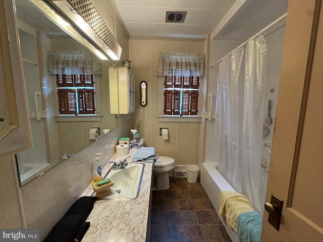 817 Maple St, Waynesboro, PA 17268 - full bathroom with toilet, vanity, shower / bathtub combination with curtain, and stone finish floors