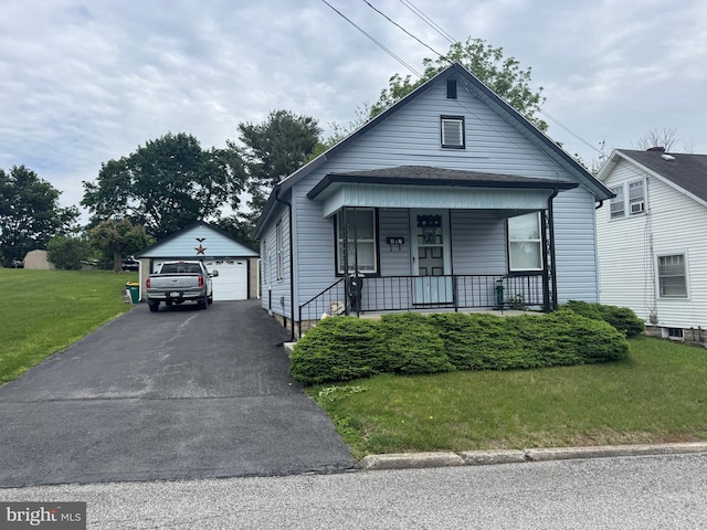 817 Maple St, Waynesboro, PA 17268 - view of front facade featuring an outdoor structure, a detached garage, a front lawn, and covered porch