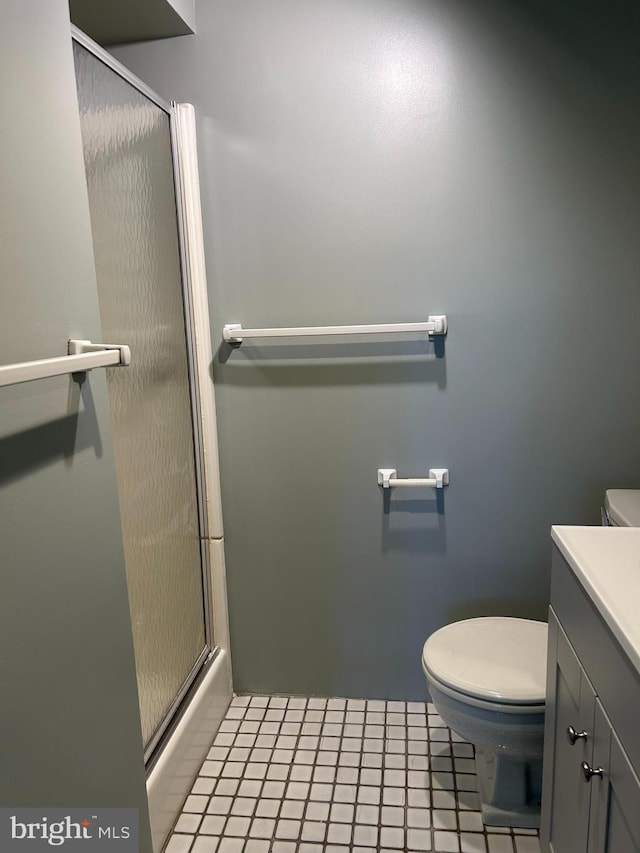 1821 Driver Ave, Lancaster, PA 17602 - bathroom featuring toilet, a shower with shower door, vanity, and tile patterned flooring