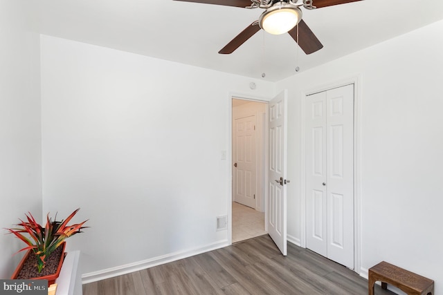 2269 Locust Ln, York, PA 17408 - unfurnished bedroom featuring wood finished floors, baseboards, a closet, and a ceiling fan