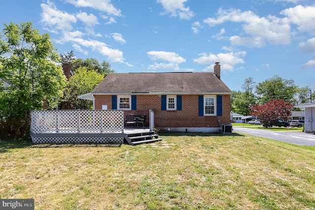 2269 Locust Ln, York, PA 17408 - rear view of house with a chimney, a yard, central air condition unit, and brick siding