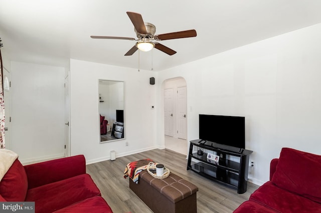 2269 Locust Ln, York, PA 17408 - living area featuring ceiling fan, wood finished floors, arched walkways, and baseboards