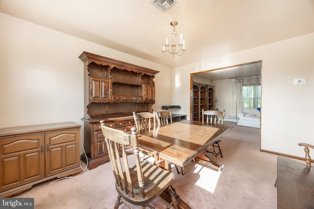 306 Spring Cir, Norristown, PA 19403 - dining space with a chandelier and light colored carpet