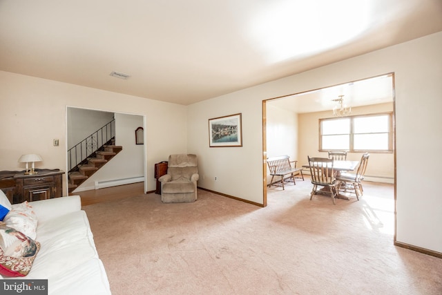 306 Spring Cir, Norristown, PA 19403 - carpeted living area with baseboard heating, stairway, a chandelier, and baseboards