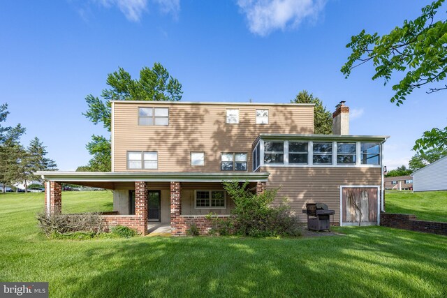 306 Spring Cir, Norristown, PA 19403 - back of house featuring a chimney, a lawn, and a porch