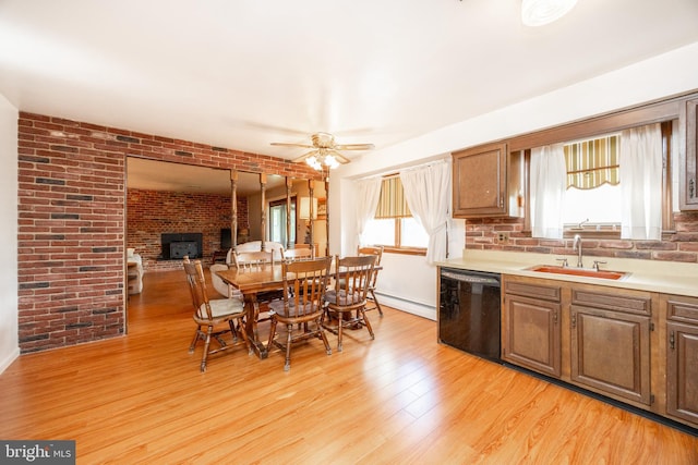 306 Spring Cir, Norristown, PA 19403 - kitchen featuring a sink, black dishwasher, ceiling fan, light wood-style floors, and light countertops