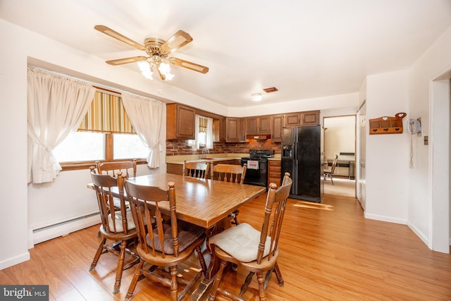 306 Spring Cir, Norristown, PA 19403 - dining area with a ceiling fan, light wood finished floors, baseboard heating, and baseboards