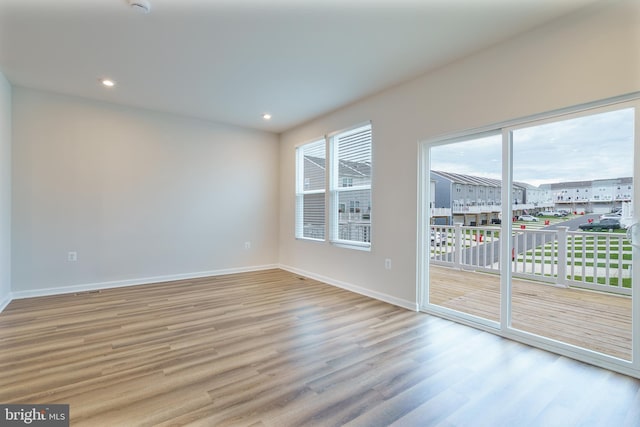 488 National St, Ranson, WV 25438 - spare room with wood finished floors, baseboards, and recessed lighting