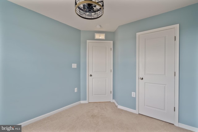 488 National St, Ranson, WV 25438 - unfurnished bedroom featuring baseboards and light carpet