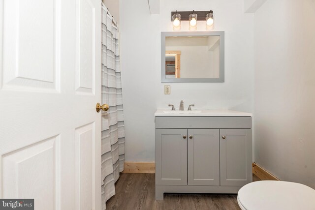 12814 Appel Rd SE, Little Orleans, MD 21766 - bathroom with wood finished floors, vanity, toilet, and baseboards