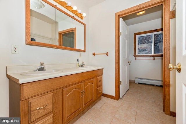 12814 Appel Rd SE, Little Orleans, MD 21766 - bathroom with a baseboard heating unit, double vanity, tile patterned floors, and baseboards
