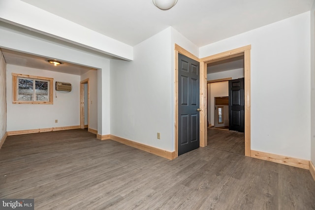 12814 Appel Rd SE, Little Orleans, MD 21766 - spare room featuring wood finished floors, an AC wall unit, and baseboards