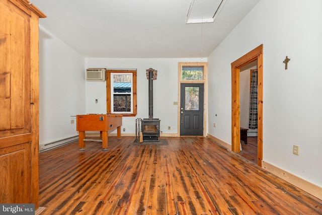 12814 Appel Rd SE, Little Orleans, MD 21766 - entryway with hardwood / wood-style floors, a wood stove, a baseboard heating unit, and baseboards
