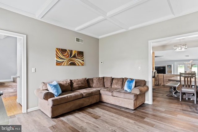 23 Skyline Dr, Mechanicsburg, PA 17050 - living area with light wood-style floors, coffered ceiling, beam ceiling, baseboards, and a chandelier