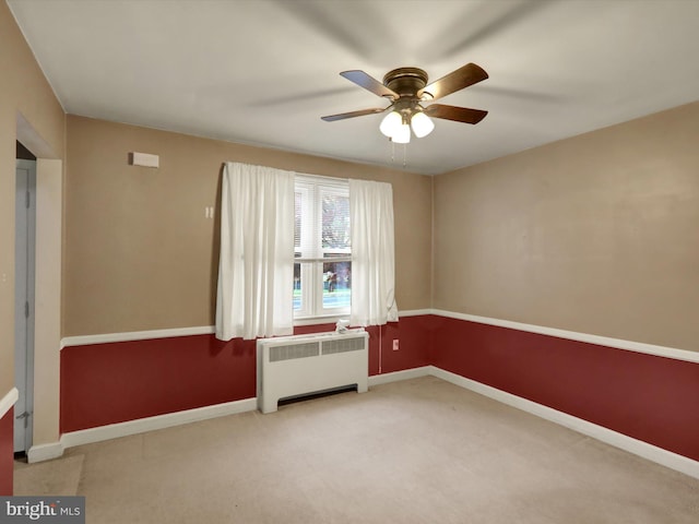 1411 College Ave, Reading, PA 19604 - spare room featuring radiator, ceiling fan, carpet, and baseboards