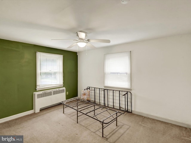 1411 College Ave, Reading, PA 19604 - unfurnished room featuring radiator heating unit, a ceiling fan, carpet, and baseboards