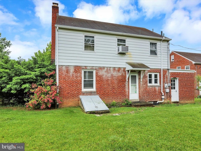 1411 College Ave, Reading, PA 19604 - back of house with a chimney, a yard, brick siding, and cooling unit