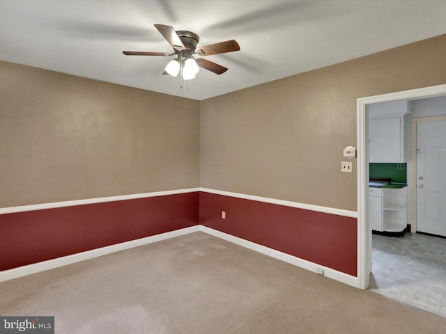 1411 College Ave, Reading, PA 19604 - spare room featuring carpet floors, ceiling fan, and baseboards