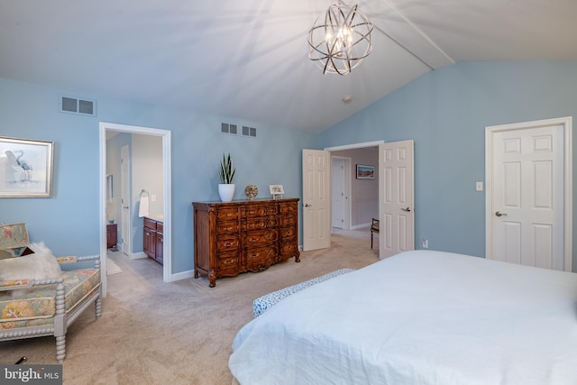 310 Valley Ct, Reading, PA 19608 - bedroom with lofted ceiling, light carpet, baseboards, and ensuite bathroom