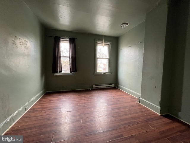 2074 E Clementine St, Philadelphia, PA 19134 - unfurnished room with a baseboard heating unit, wood finished floors, and baseboards