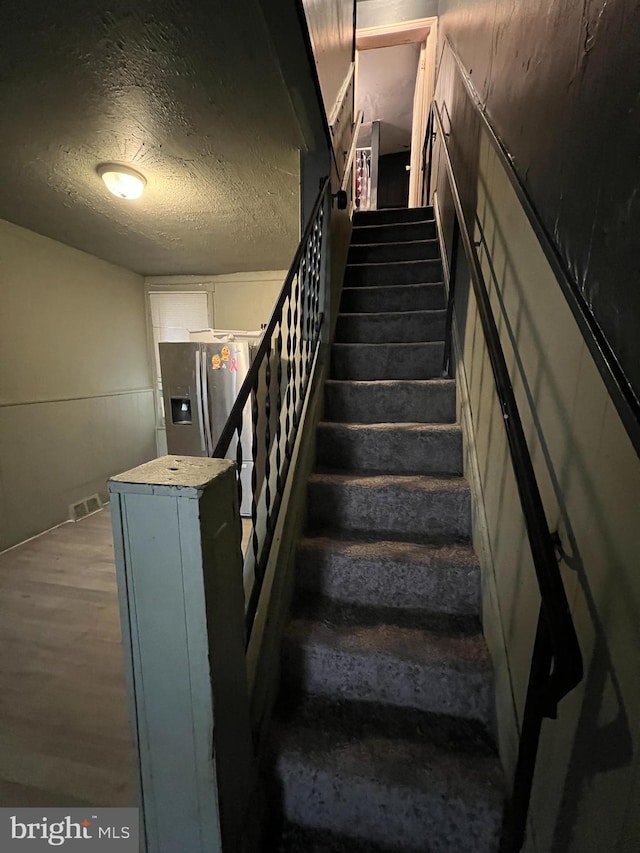 2074 E Clementine St, Philadelphia, PA 19134 - stairway with a textured ceiling