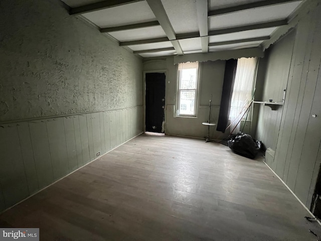 2074 E Clementine St, Philadelphia, PA 19134 - empty room with wood finished floors, beamed ceiling, wainscoting, and wooden walls
