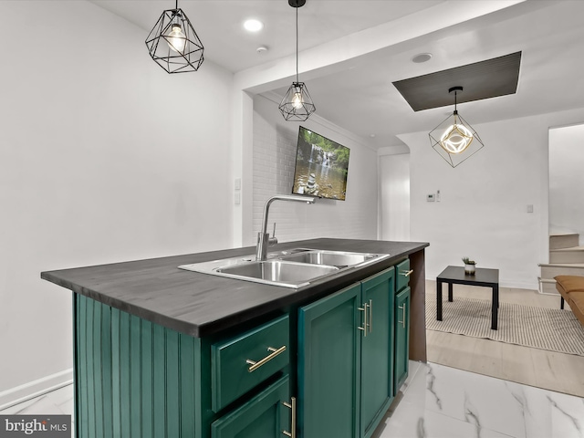 2002 E Preston St, Baltimore, MD 21213 - kitchen featuring a sink, green cabinetry, dark countertops, an island with sink, and light marble finish floors