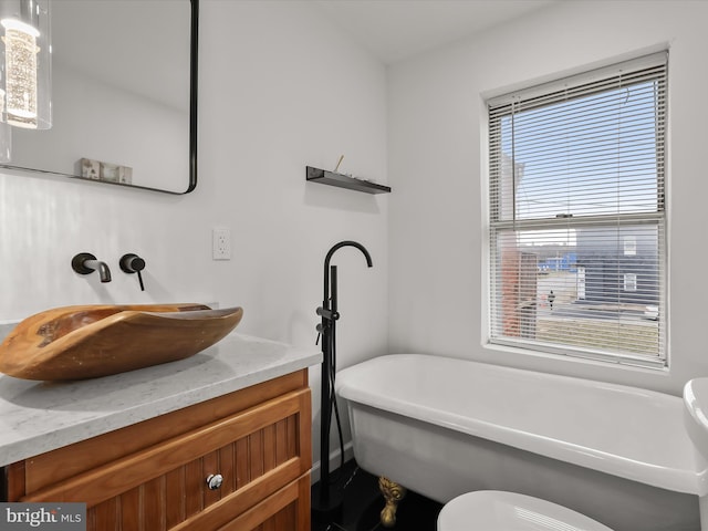 2002 E Preston St, Baltimore, MD 21213 - full bath featuring vanity and a soaking tub