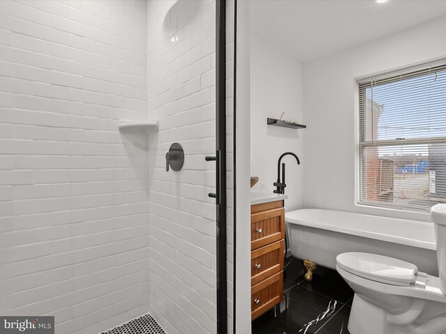 2002 E Preston St, Baltimore, MD 21213 - full bath featuring a shower stall, toilet, and a soaking tub