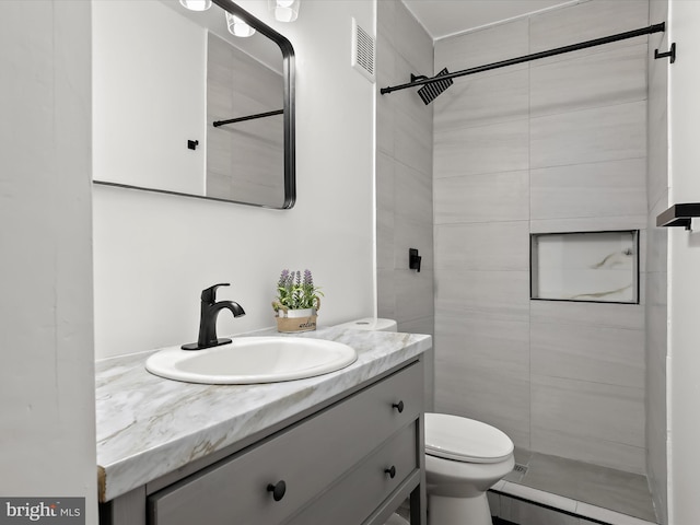 2002 E Preston St, Baltimore, MD 21213 - bathroom with toilet, vanity, and tiled shower