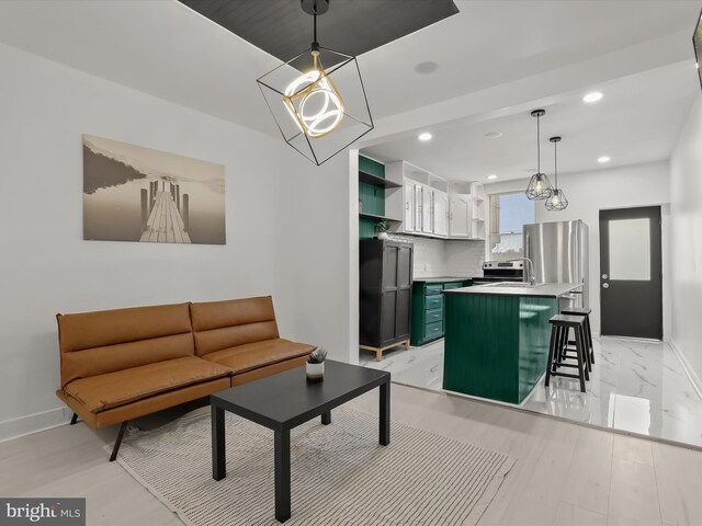2002 E Preston St, Baltimore, MD 21213 - living room with baseboards, a chandelier, and recessed lighting