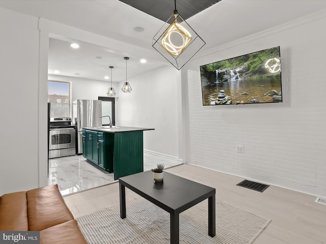 2002 E Preston St, Baltimore, MD 21213 - living area featuring recessed lighting, baseboards, and brick wall